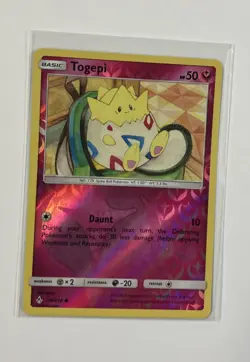 2019 Pokemon Togepi 136/214 Sm-Unbroken Bonds Reverse Holo - Image 1