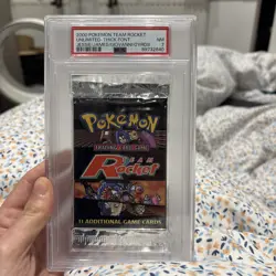 Pokemon Team Rocket PSA 7 Graded Booster Pack Unlimited Thick Front - Image 1