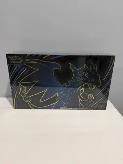 Pokemon Trading Card Game: Mega Charizard X ex Ultra-Premium Collection In Hand - Image 1