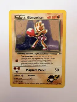 Rocket’s Hitmonchan #11/132 Gym Heroes Holo Pokemon Card – HP - Image 1