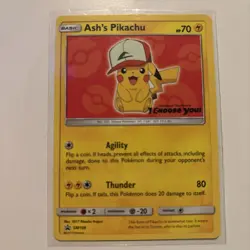 Ash's Pikachu SM109 Black Star Promo 2017 Pokemon Card Plus 100+ Random Cards - Image 1