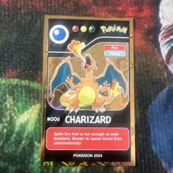 2024 Pokemon Pokedex Black Edition #006 Charizard Gold Heart Holo - Image 1