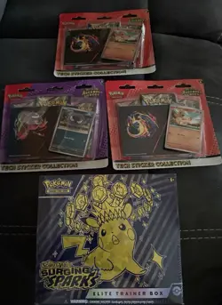 Pokemon TCG Surging Sparks ETB + 3 Ascended Heroes Tech Bundle ￼Factory Sealed - Image 1