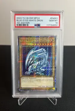 2024 YU-GI-OH! MP24-25TH ANV TIN: DUELING MIRRORS BLUE-EYES WHITE DRAGON PSA 10 - Image 1