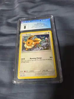 Pokemon Eevee CGC 8 Black Star Promo SM235 Holo - Image 1