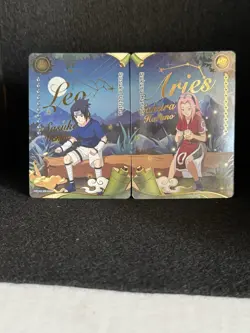 Naruto CCG Foil Leo Sasuke Uchiha & Aries Sakura Haruno English Standard Cards - Image 1
