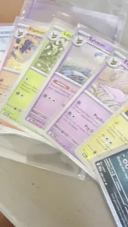 Pokemon Prismatic Evolutions Costco Cosmos Holo Eevee Evolution Set Of 8 - Image 2