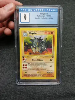 CGC MINT 9 Rhydon 45/64 Jungle 1st Edition (1999) Pokemon TCG - Image 1