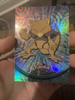 1999 Topps Pokemon TV Animation #63 Abra Rainbow Foil Black Logo - Image 1
