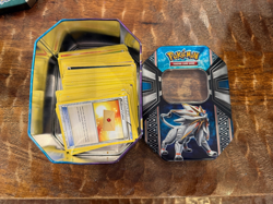 Pokemon Tins with random card lot + 11 Pokemon-GX cards, gently used condition - Image 2
