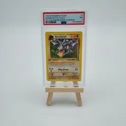 1999 POKEMON FOSSIL 1ST ED-PRERELEASE-COSMOS #1 AERODACTYL-HOLO PSA 7 - Image 1