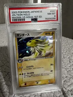 Jolteon Holo 037/080 Magma VS Aqua 1st Ed - PSA 8 - Image 1