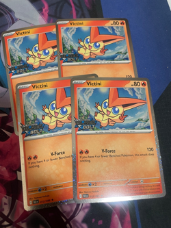 POKEMON - VICTINI X4 - BLACK BOLT STAMPED - NM - COSMOS HOLO - Image 1