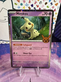Pokemon Trick-or-Trade 2024 Cosmo Holo Paldean Fates 037/091 Mimikyu - Image 1