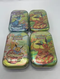Pokemon TCG Scarlet & Violet Prismatic Evolutions- Lot Of 4 Mini Tin’s SEALED - Image 1