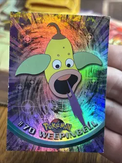 1999 Topps Pokemon TV #70 Weepinbell Rainbow Foil Blue Logo - Image 1