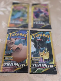 Pokemon Sun & Moon Team Up Mini Booster Pack Lot (4) – Snorlax & Eevee, Pikachu - Image 1