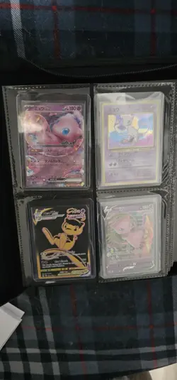 Pokemon cards in pokemon binder. - Image 1