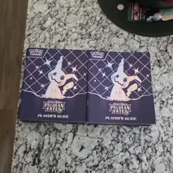 Pokemon Scarlet & Violet Paldean Fates Player's Guide Mimikyu English Paper - Image 1