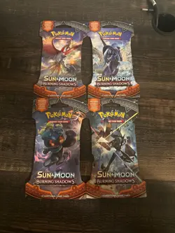 2017 Pokemon Sun & Moon Burning Shadows 4 Sleeved Booster Pack Art Set - Image 1