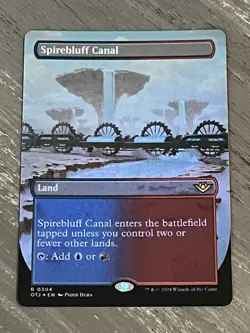 Spirebluff Canal (Borderless, Foil) Outlaws of Thunder Junction (OTJ) EN R 0304 - Image 1