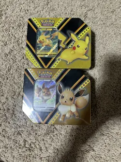 Lot Of 2 Pokemon Card Game (TCG): Eevee V Powers Tin & Pikachu V Powers Tin NEW - Image 1