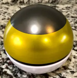 Pokemon Level Ball Tin, Yellow, Black & Red, w/ 50 Mixed Trading Cards - Image 2