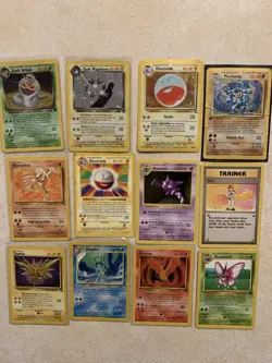 DAMAGED Lot of 70 Vintage Pokemon Cards 7x Holos, 30+ Rares Shadowless & 1st Ed - Image 1