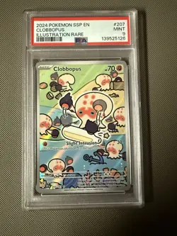 PSA 9 Pokemon Surging Sparks Clobbopus 207/191 Illustration Rare Holo - Image 1