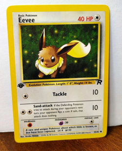 POKEMON EEVEE 55/82 1ST EDITION TEAM ROCKET LP-NM - Image 1