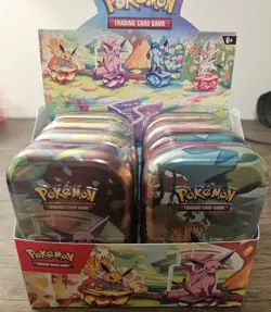 Pokemon TCG Prismatic Evolutions Mini Tin Open Display With 8 Sealed Tins - Image 1