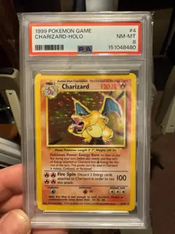 1999 POKEMON BASE SET UNLIMITED #4 CHARIZARD-HOLO PSA 8 - Image 1