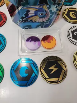 Lot of 16x Official Pokemon TCG Coins Lot & Vaporeon Evolutions Card Tin (Empty) - Image 4