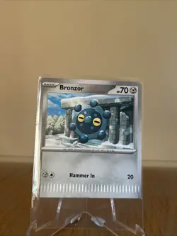 Rare Error/Crimped Cut -Bronzor #66 Pokemon Prismatic Evolutions - Image 1