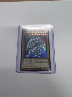 Yu-Gi-Oh Blue-Eyes White Dragon LCKC-EN001 Ripple Art Ultra Rare Unlimited NM - Image 1