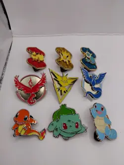 POKEMON lot Of 9 Pokemon TCG Pins Starters, Pokemon Go And Eevelutions - Image 1