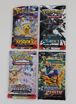 POKEMON 4 BOOSTER PACKS BLACK BOLT, CROWN ZENITH, PRISMATIC, SURGING SPARKS - Image 1