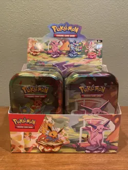 Pokemon TCG Prismatic Evolutions Full Set of 8 Sealed Mini Tins With Display - Image 1