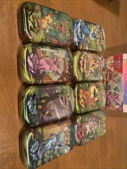 Pokemon TCG Prismatic Evolutions Full Set of 8 Sealed Mini Tins With Display - Image 5