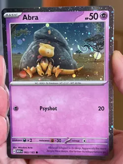 POKEMON ABRA 063/165 COSMOS HOLO WITH HD SWIRL SCARLET & VIOLET 151 NM CARD - Image 1