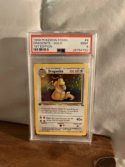 1999 Pokemon Dragonite Holo, 1st Edition Fossil #4/62, PSA 9 Mint - Image 1
