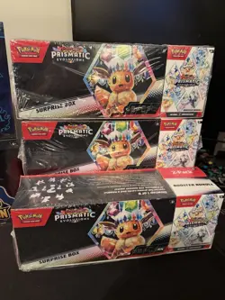 Pokemon Prismatic Evolutions Surprise Box + Booster Bundle 2 Pack - Image 1