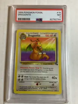 1999 POKEMON FOSSIL #19 DRAGONITE PSA 7 - Image 1