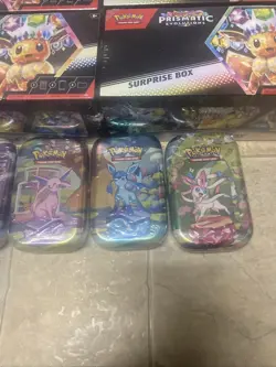 Pokemon Prismatic Evolutions Surprise Box Lot Of 4 And 4 Mini Tins - Image 3
