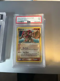 2006 POKEMON EX LEGEND MAKER GOLD STAR #91 REGIROCK-HOLO PSA 7 NM - Image 1