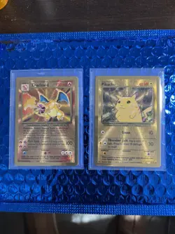 2021 CHARIZARD #4 & PKACHU #58 CELEBRATIONS ULTRA PREMIUM COLLECTION METAL CARDS - Image 1
