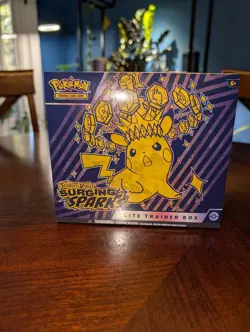 Pokemon TCG Surging Sparks ETB, Factory Sealed + 1 graded guard case - Image 1