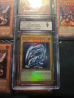 YU-GI-OH! BLUE-EYES WHITE DRAGON MAGO-EN001 1st FIRST EDITION MAXIMUM GOLD CGC 9 - Image 1