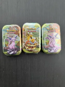 Pokemon TCG Prismatic Evolutions Mini Tins X3 Factory Sealed - Image 1