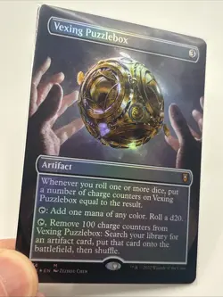 Vexing Puzzlebox (Borderless) #374 (Foil) (NM) Baldur's Gate CLB Magic MTG - Image 1